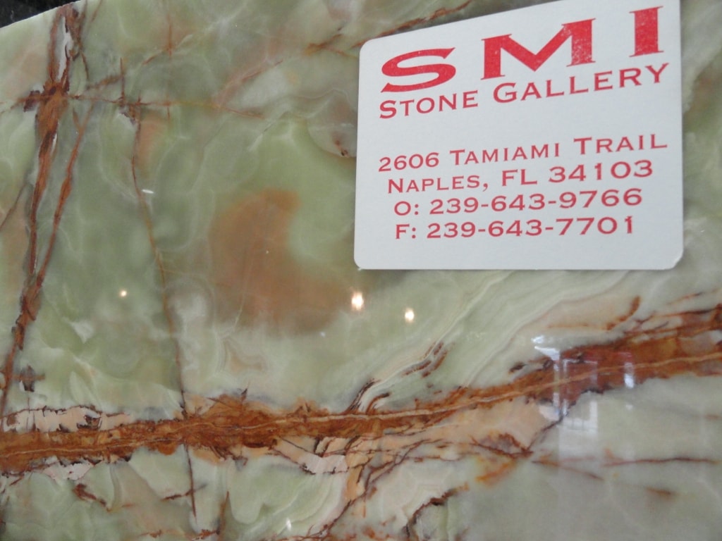 SMI Stone Gallery business card on green onyx slab