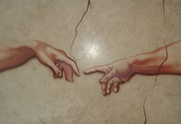 Hands selecting marble stone